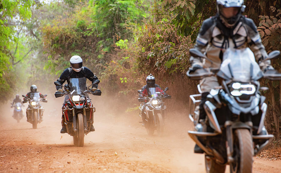 Group Of Men Riding Their Adventure Motorbike On Dirt Road In Cambodia ...