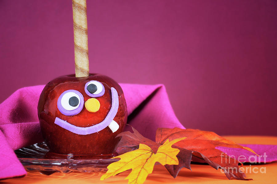 Halloween crazy face red toffee candy apples #1 Photograph by Milleflore Images