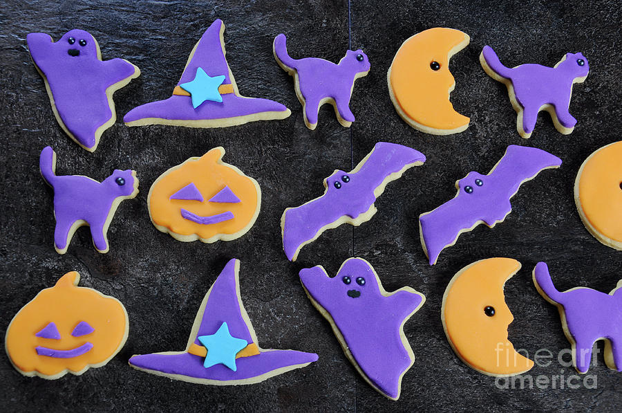 Halloween orange and purple sugar cookies  #1 Photograph by Milleflore Images