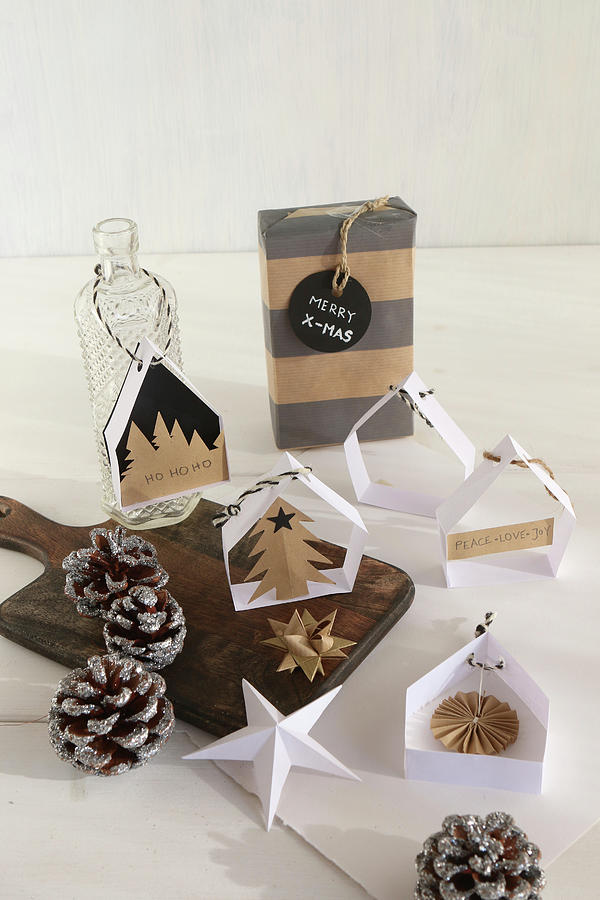 Handcrafted Christmas Decorations: Small Paper Houses For Hanging Up #1 Photograph by Regina Hippel
