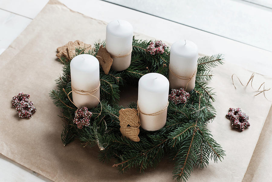 Handmade Advent Wreath With Fir Branches, Biscuits And White Candles #1 Photograph by Jelena Filipinski