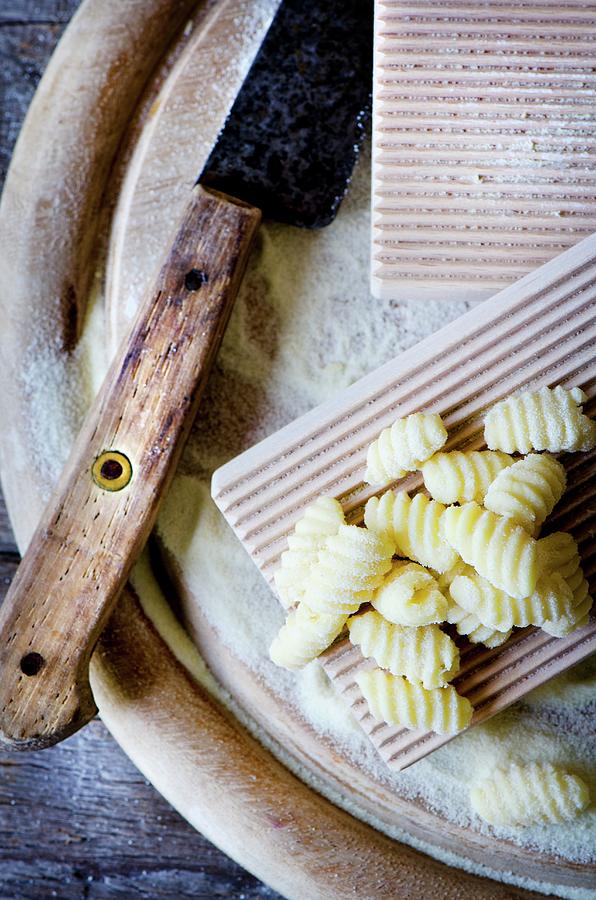 Cereal Photograph - Handmade Sardinian Gnocchetti malloreddus On A Wooden Plate With Semolina #1 by Jamie Watson