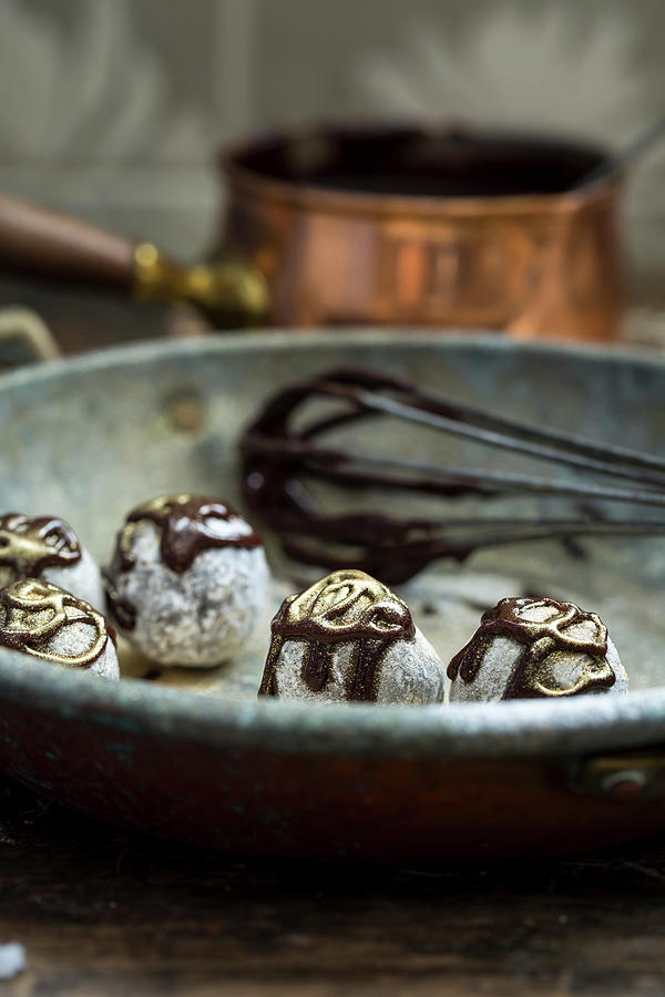 Handmade Truffle Pralines With Chocolate Sauce #1 Photograph by Lara Jane Thorpe