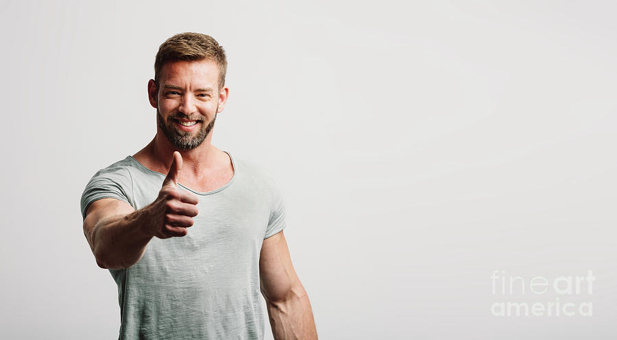 Happy Man Showing Ok Gesture And Smiling Photograph