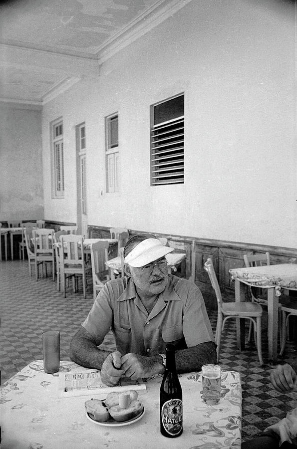 Black And White Photograph - Hemingway At Restaurant #1 by Alfred Eisenstaedt