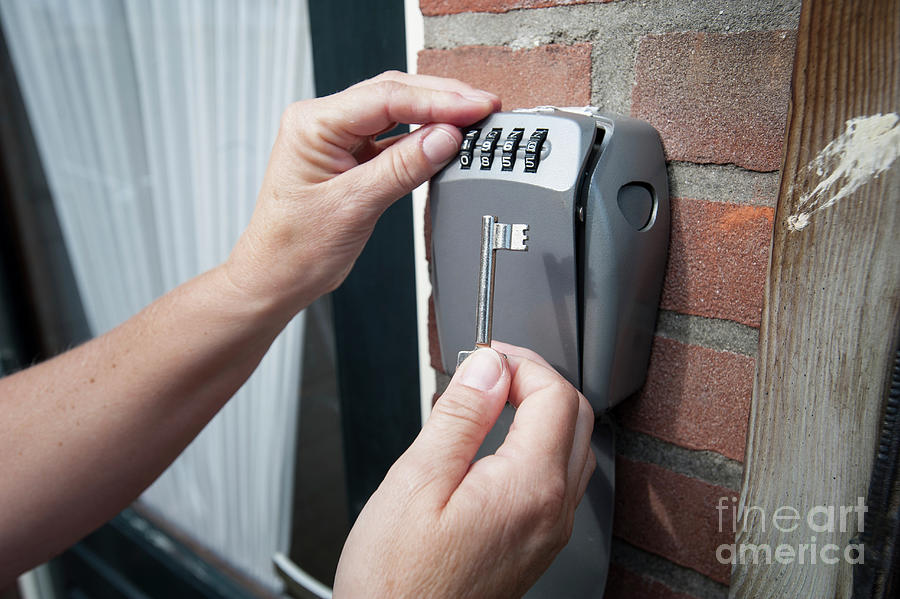 Key Photograph - Home Visit Nurse Using Key Safe #1 by Arno Massee/science Photo Library
