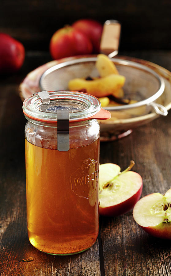 Homemade Baked Apple Liqueur With Vanilla, Anise, Cinnamon And Corn Schnapps #1 Photograph by Teubner Foodfoto