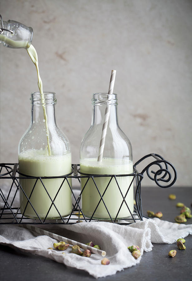 Homemade Pistachio Milk With Straws In Bottles #1 Photograph by Kati Finell