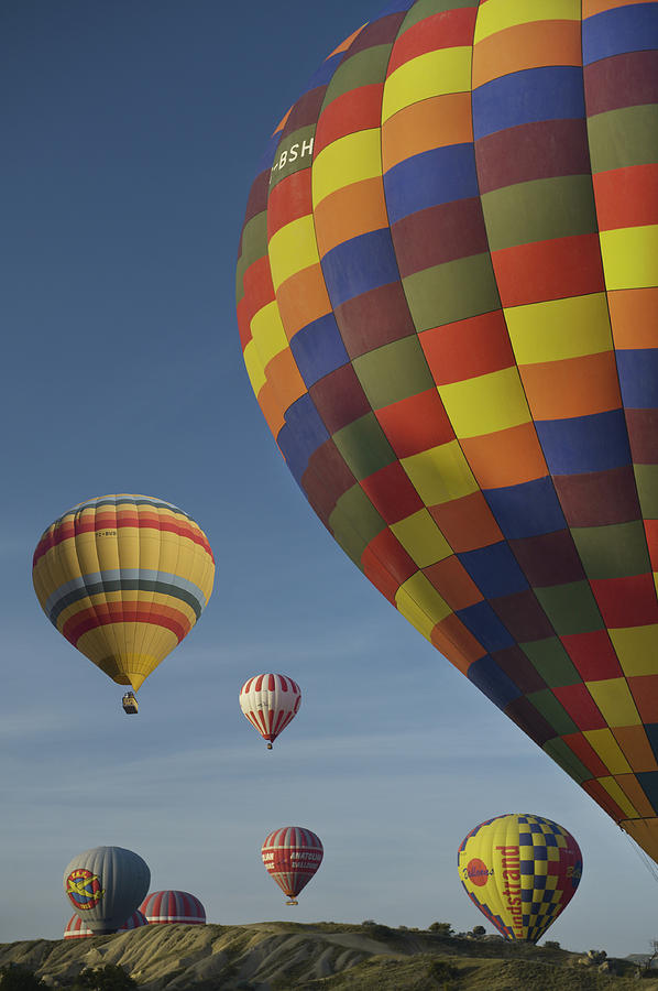Hot-air Ballooning In Cappadocia #1 Photograph by Izzet Keribar