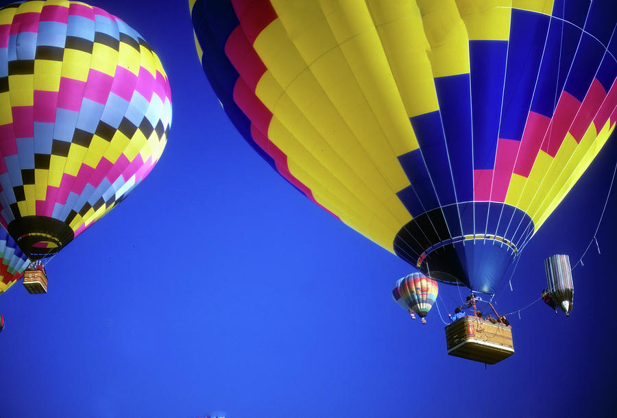 Hot air balloons against blue sky #1 Photograph by Steve Estvanik