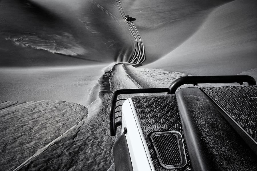 Black And White Photograph - Hot Pursuit #1 by Marco Tagliarino
