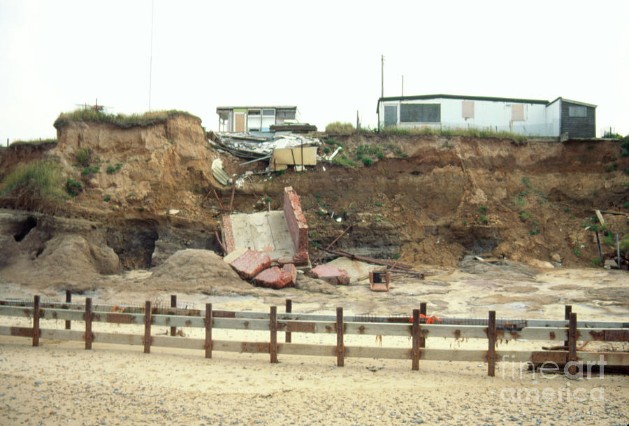 Houses Located At The Edge Of A Sea Eroded Cliff #1 Photograph by Graeme Ewens/science Photo Library