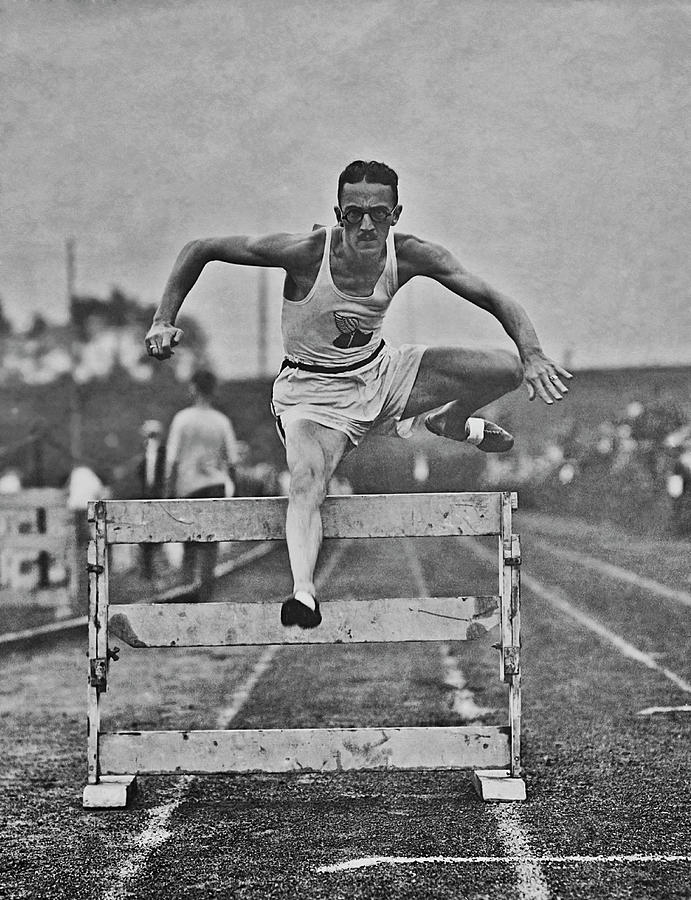 Hurdler In Action #1 Photograph by Fpg