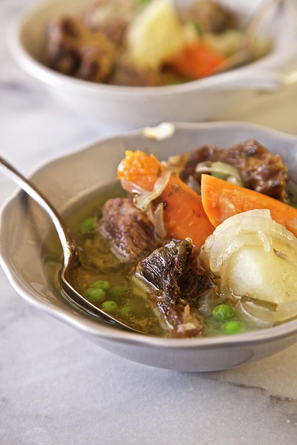 Irish Stew With Lamb Shoulder, Potatoes, Carrots, Onions And Peas emerald Isle, Ireland #1 Photograph by Andre Baranowski