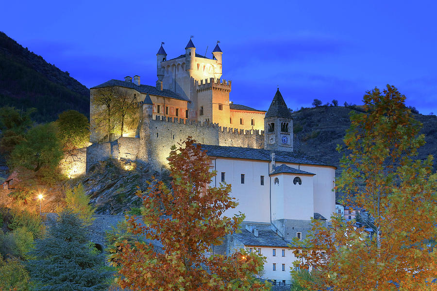 Italy, Aosta Valley, Aosta District, Alps, Saint-pierre, The Saint-pierre Castle In Autumn With Evening Lights #1 Digital Art by Davide Carlo Cenadelli