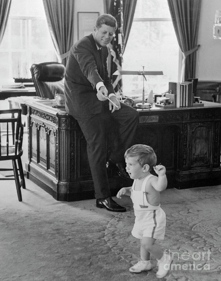 John F Kennedy Photograph - John F. Kennedy With 18 Month Old Son #1 by Bettmann