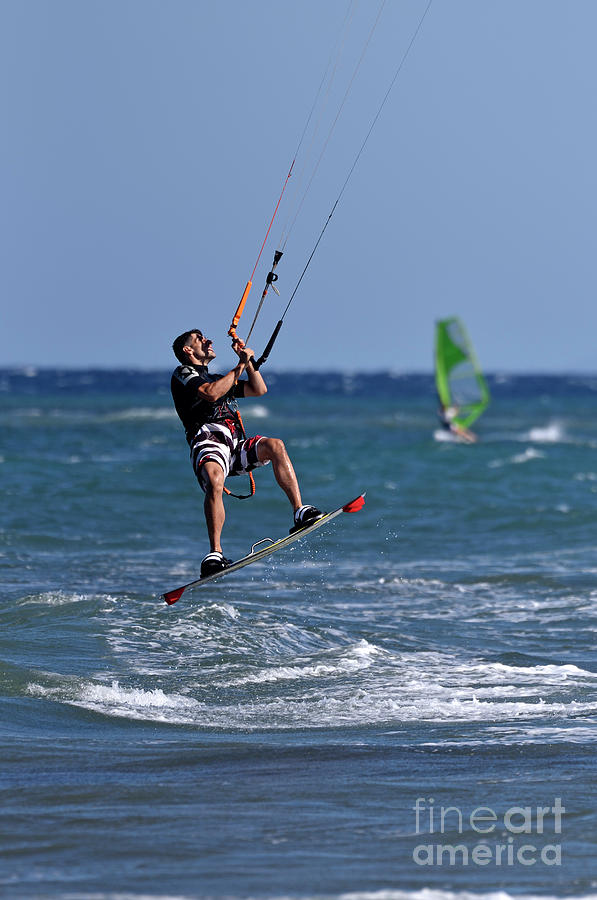 Kite surfing on a windy day III #1 Photograph by George Atsametakis