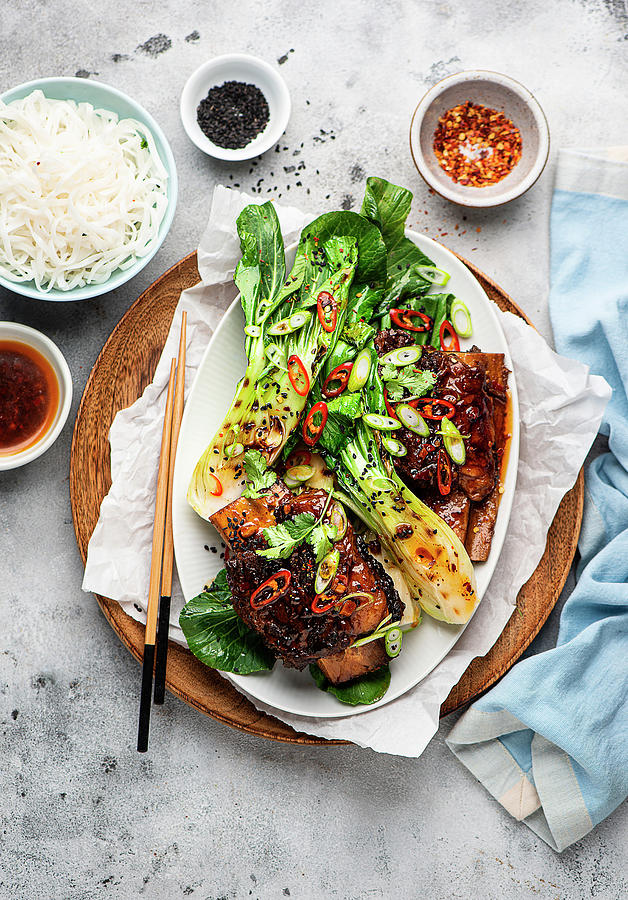 Korean-style Beef Ribs With Bok Choy And Rice Noodles #1 Photograph by Ewgenija Schall