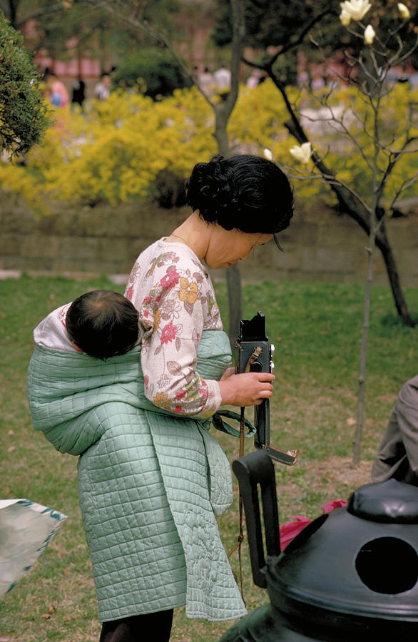 Korean Woman With Baby And A Camera Photograph
