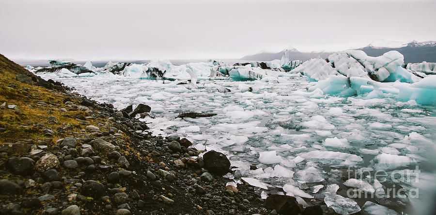 Large blocks of broken ice from an Icelandic glacier. #1 Photograph by Joaquin Corbalan