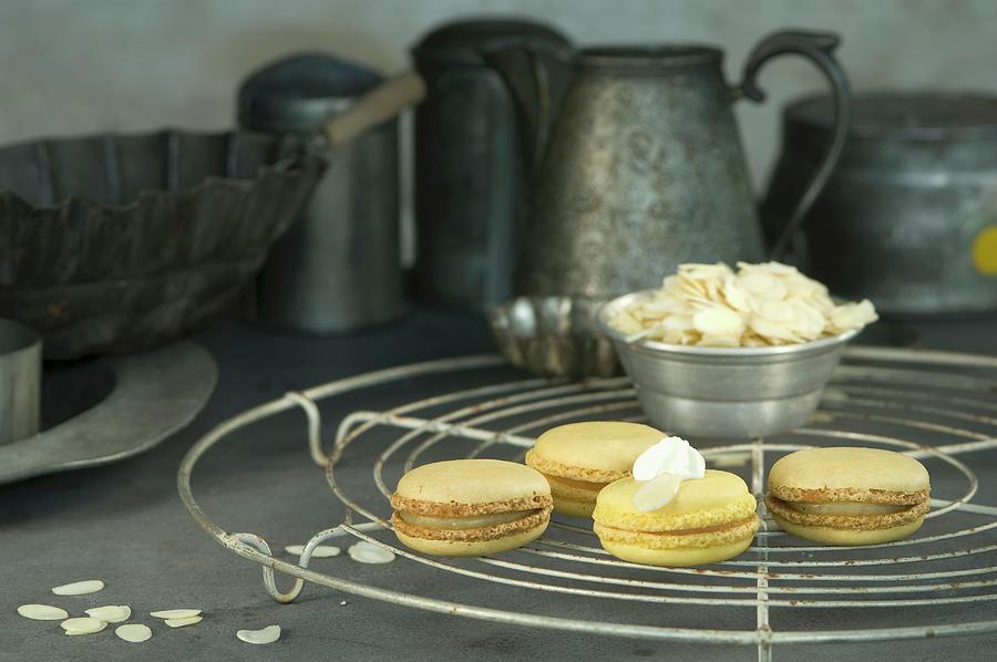 Lemon Macaroons With Flaked Almonds On A Wire Rack #1 Photograph by Achim Sass