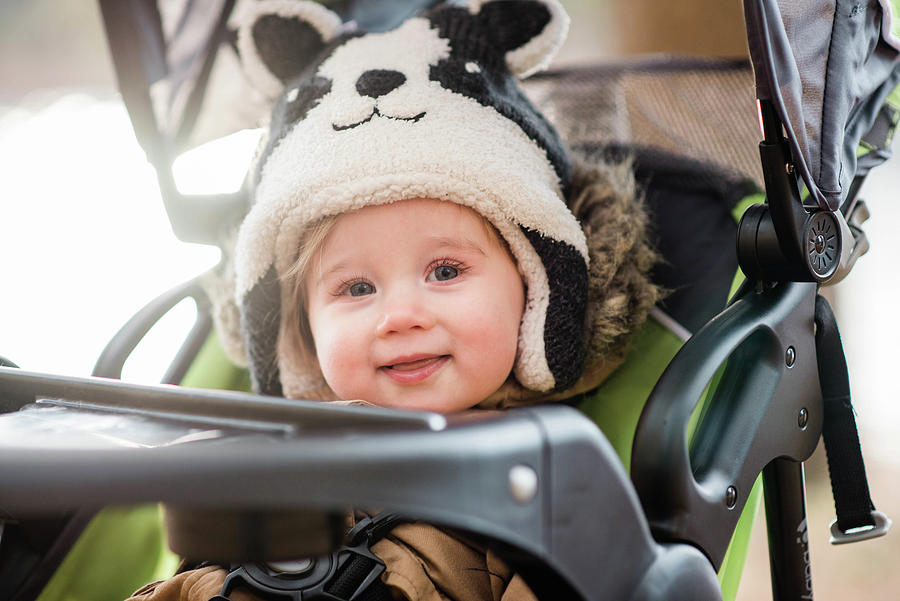 Little Girl In A Stroller. Photograph by Cavan Images - Fine Art America