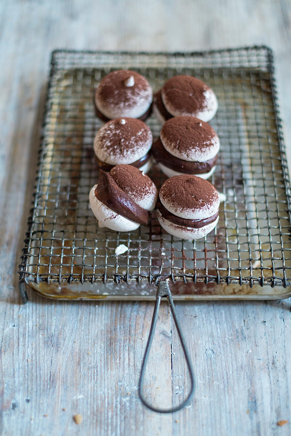 Macaroons With Chocolate Cream And Cocoa Powder #1 Photograph by Eising Studio