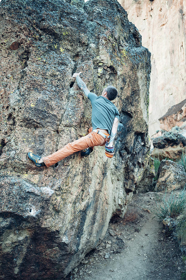 Sports Photograph - Male Climber Getting To The Top Of The Boulder In Smith Rock Park #1 by Cavan Images