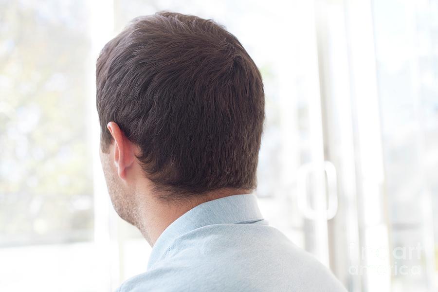 Man looking out of window - Stock Image - F009/8001 - Science