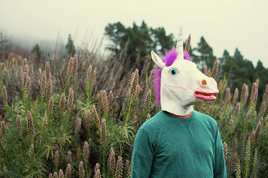 Man With The Unicorn Mask Portrait Photograph by Cavan Images - Fine ...