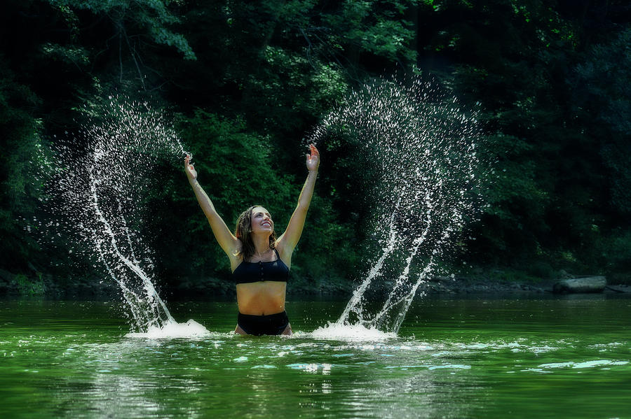 Mandy splashing water in the lake #1 Photograph by Dan Friend