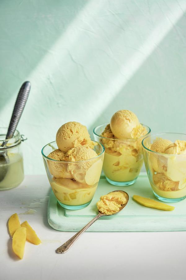 Mango Ice Cream With An Ice Cream Scoop #1 Photograph by Magdalena Hendey