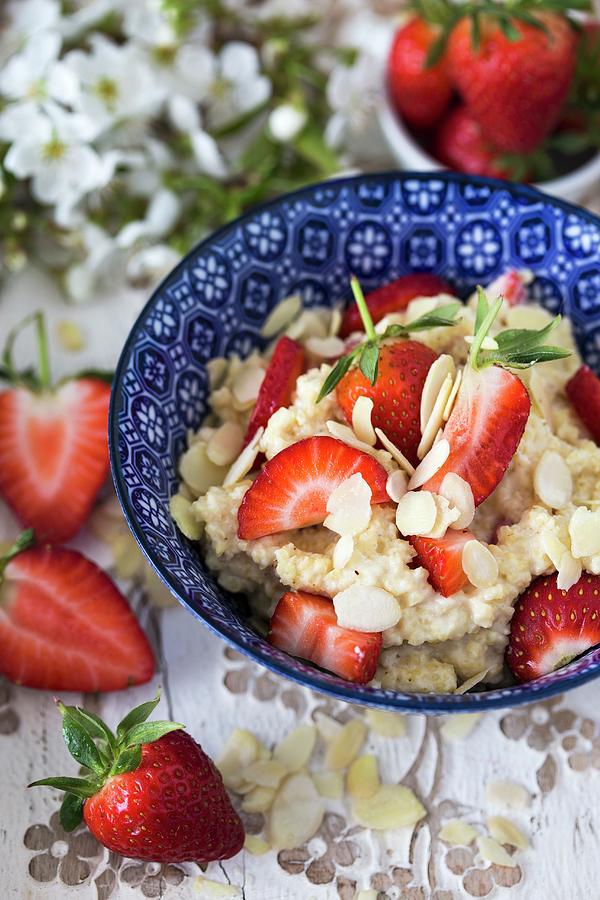 Millet Porridge With Fresh Strawberries And Flaked Almonds #1 Photograph by Malgorzata Laniak
