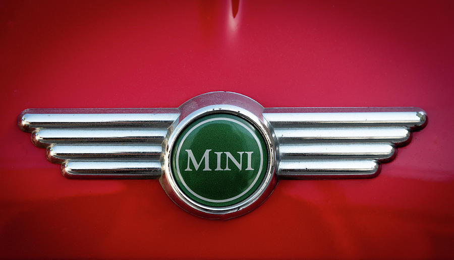 Mini Cooper car logo on red surface #2 Photograph by Michalakis Ppalis