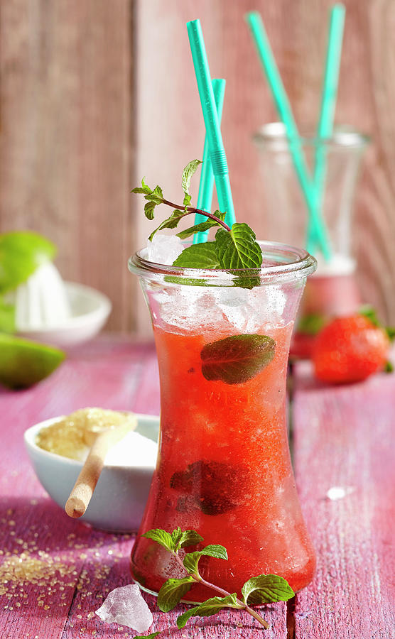 Mojitos With Strawberries, Strawberry Syrup And Crushed Ice #1 Photograph by Teubner Foodfoto