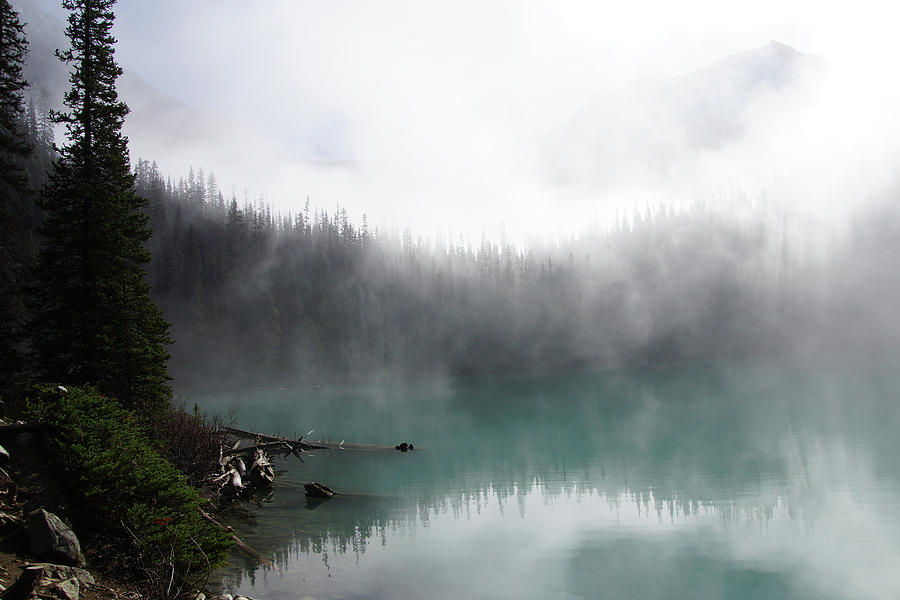 Morning mist rising from  turquoise lake #1 Photograph by Steve Estvanik
