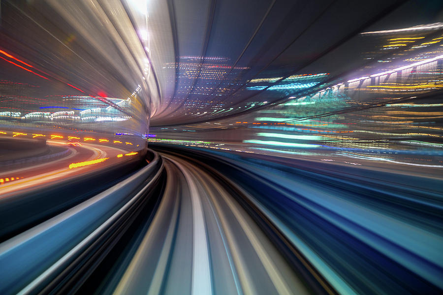 Motion blur of a city and tunnel from inside a moving monorail i #1 Photograph by Anek Suwannaphoom
