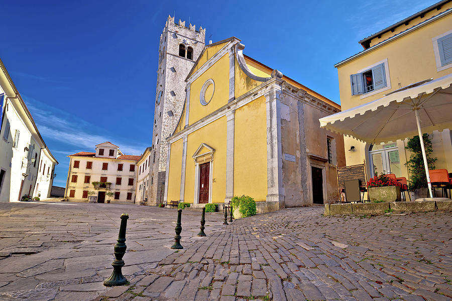 Motovun. Main stone square and church in historic town of Motovu #1 Photograph by Brch Photography