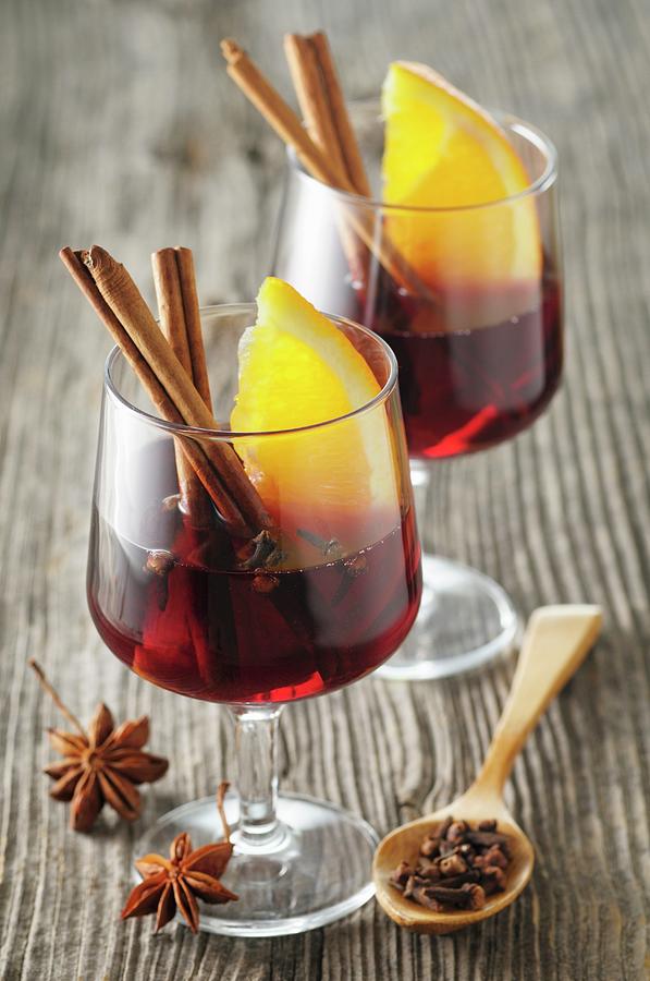 Mulled Wine With Spices And Orange Wedges #1 Photograph by Jean-christophe Riou