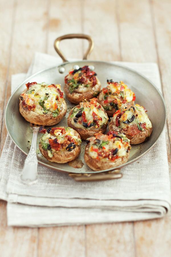 Mushrooms Stuffed With Mozzarella, Dried Tomatoes, Black Olives And Herbs #1 Photograph by Rua Castilho