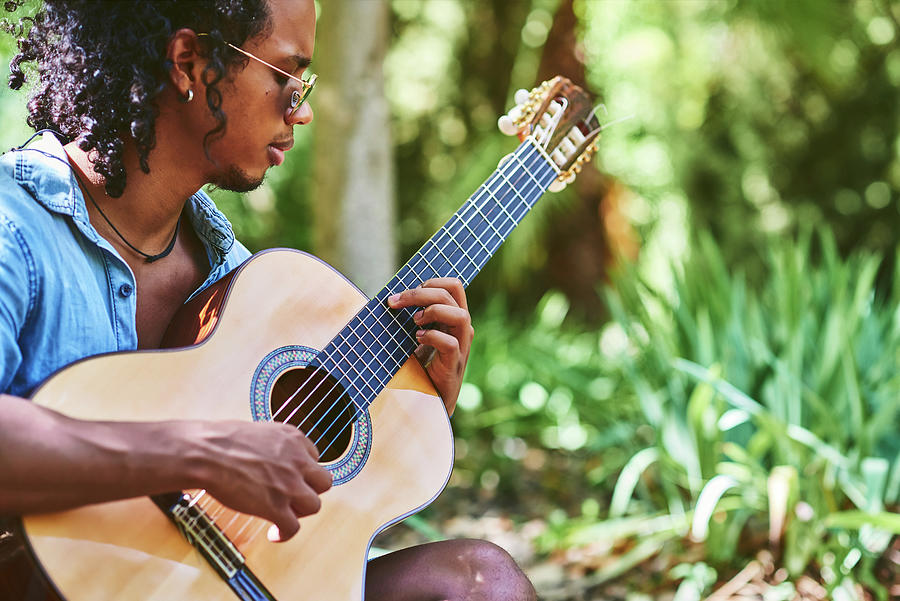 Musician Practicing With The Guitar In The Field. Photograph by Cavan ...