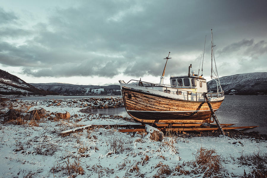 Norwegian Wooden Boat Beached At Sunset With Snow #1 Photograph by ...