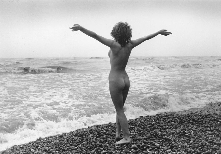 nudist beach, evening standard, 1980-1989,england,looking around,stretching...