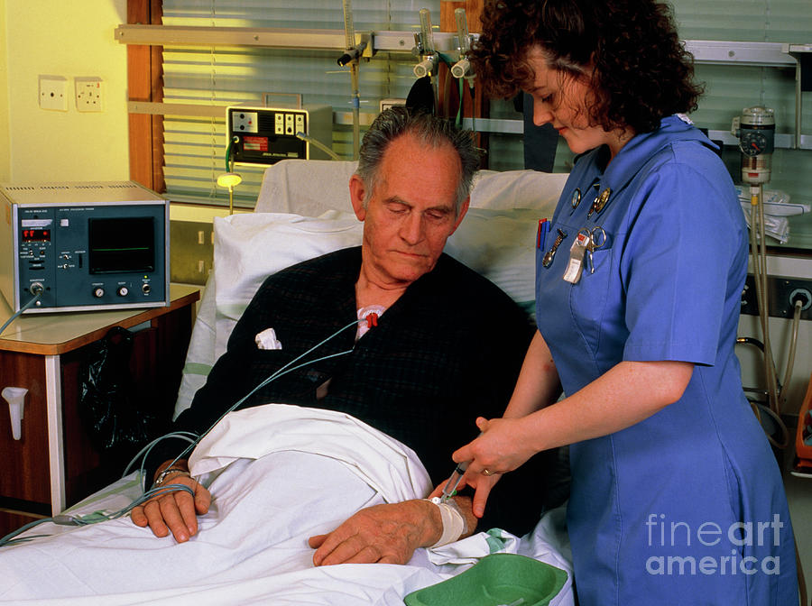 Nurse Giving Injection To Coronary Care Patient #1 Photograph by Simon Fraser/coronary Care Unit, Freeman Hospital, Newcastle/science Photo Library