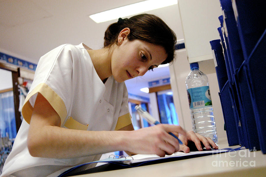 Nurse Writing Notes #1 Photograph by Aj Photo/science Photo Library