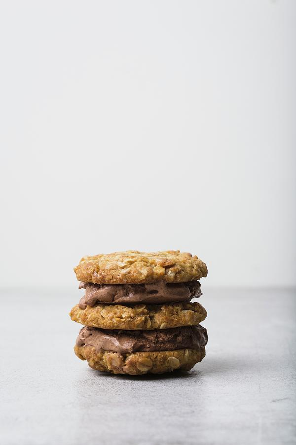 Oat Cookie And Chocolate Ice Cream Sandwich #1 Photograph by Rose Hewartson