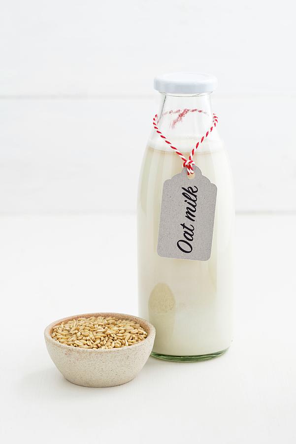 Oat Milk In A Glass Bottle With A Label #1 Photograph by Elisabeth Clfen