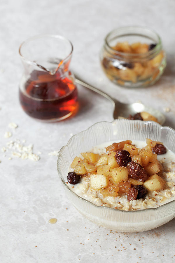 Oat Porridge Topped With Apple And Raisin Compote #1 Photograph by Jane Saunders