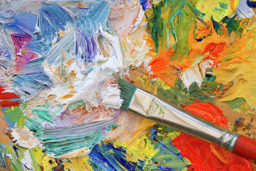 Mixes oil paints on palette with brush Stock Illustration by