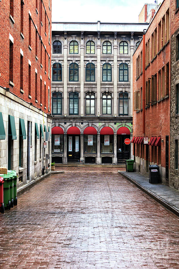 Architecture Photograph - Old Montreal Alley by John Rizzuto